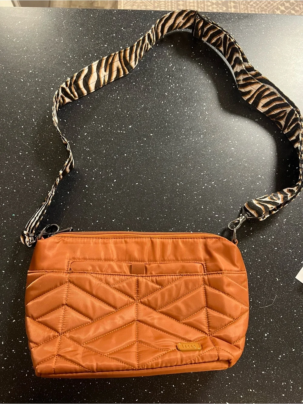 lug Quilted Crossbody Bag in Burnt Orange with Zebra-Print Strap